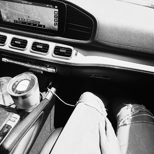 Neeli Faulkner in a car, taking field notes during an investigation